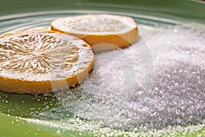 Citric acid and two slices of a lemon