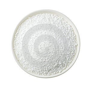 Citric acid in a white bowl against a white isolated background