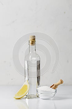 Citric acid, white vinegar and a slice of lemon