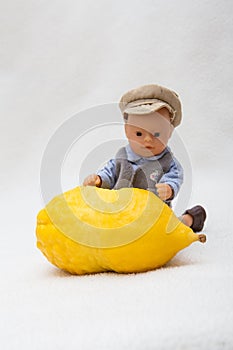 Citron - etrog with doll child photo