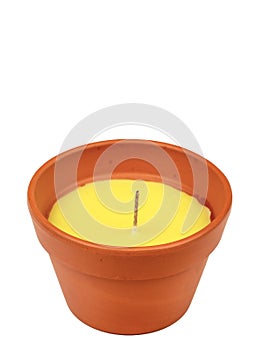 Citronella candle in a clay pot. A mosquito repellant for outdoor use