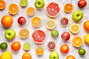 Citrus colorful fruits background mix flat lay, summer healthy vegetarian vitamin food