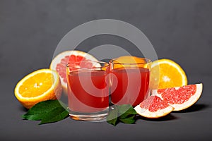 Citrus drink, fresh citrus smoothie juice on dark background