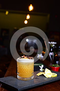 citrus fruit alcoholic iced drink fruit juice with cinnamon isolated on black background