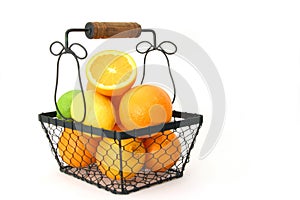 Citrus Fruit In A Basket Over White