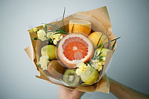 Citrus fruit bouquet. Edible orange bouquet with flowers.