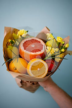 Citrus fruit bouquet. Edible orange bouquet with flowers.