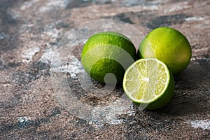 Citrus fruit lime on a rustic dark background. Selective focus
