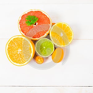 Citrus fruit on the white wooden table