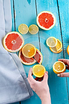 Citrus fruits against a blue wooden table