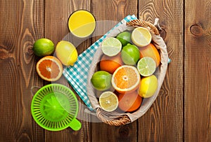 Citrus fruits and glass of juice. Oranges, limes and lemons