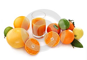 Citrus fruits and juice in glass