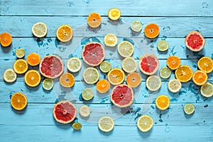 Citrus fruits orange, lemon, grapefruit, mandarin, lime on blue background