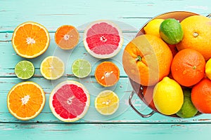 Citrus fruits in retro colander.