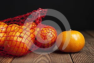 Citrus Fruits Tangerine in Oranges in plastic net bag package. no plastic concept. Packaging that does not recycle. Plastic. Rusti