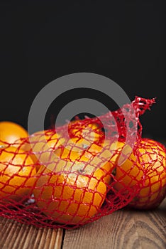 Citrus Fruits Tangerine in Oranges in plastic net bag package. no plastic concept. Packaging that does not recycle. Plastic. Rusti