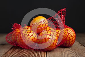 Citrus Fruits Tangerine in Oranges in plastic net bag package. no plastic concept. Packaging that does not recycle. Plastic. Rusti