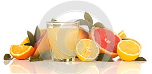 Citrus juices. lemon juice in a glass with fresh fruit on a white isolated background
