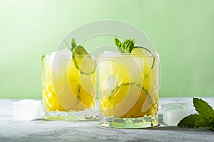Citrus lemonade with ice cubes, juice and lime fruit ,summer refreshing drink