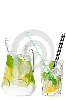 Citrus lemonade in pitcher and glass , closeup