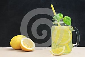 Citrus lemonade water with lemon sliced , healthy and detox