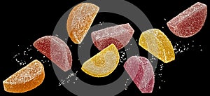 Citrus marmalade candies with sugar on black background