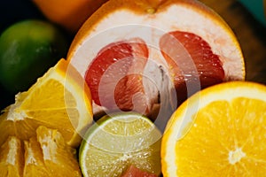 Citrus, oranges, lemons, limes, grapefruit, pomelo on vintage bo