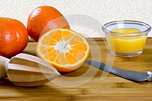 Citrus reamer and tangerines photo