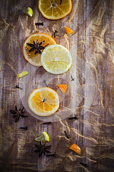 Citrus spices colorful background slices lemon orange cloves cinnamon