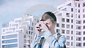 City Adventures: Boy Exploring with Camera for Perfect Shots