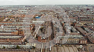 City aerial view over Amsterdam, The Netherlands. View on a Usual Living District with traffic and channel