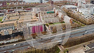 City aerial view over Amsterdam, The Netherlands. View on a Usual Living District with traffic and channel