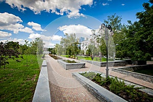 City alley with flower beds and lawns, accomplishment of territory