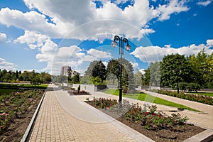 City alley with flower beds and lawns, accomplishment of territory