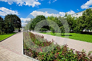 City alley with flower beds and lawns, accomplishment of territory