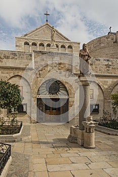 City of Bethlehem. The church Catherine next to the Basilica of the Nativity of Jesus Christ. Column with the figure of Saint