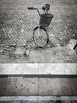 City bicycle or bikes parked on the side of the road