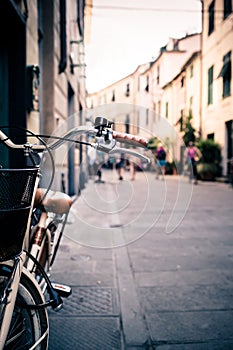 City bicycle handlebar, bike over blurred background