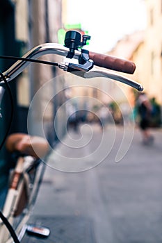 City bicycle handlebar, bike over blurred beautiful bokeh backgr photo