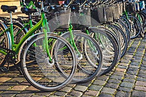 City bikes rent in big city. Ekological transport. Share-use bicycles in a  city centre.