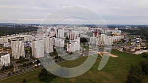 City block. Modern multi-storey buildings. Flying at dusk at sunset. Aerial photography