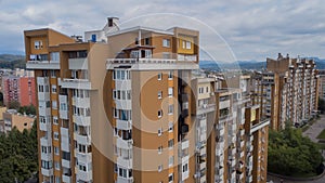 City block or skyscraper in Ljubljana, Slovenia, damaged by fire in the 8th floor. Visible black smoke residue on the facade and