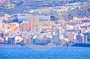 A city with a blue ocean in the background