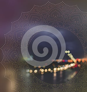 City bokeh with peaceful mandala