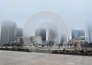 City buildings covered in heavy fog