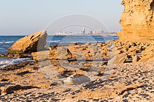 City buildings sea shore view, sunset.