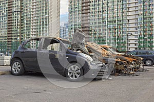 City burned cars after a fire in one of the city`s districts