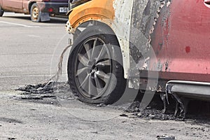 City burned cars after a fire in one of the city`s districts