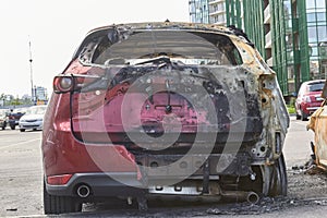 City burned cars after a fire in one of the city`s districts