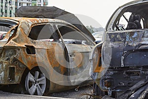 City burned cars after a fire in one of the city`s districts